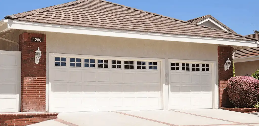 Residential garage door repair service for a double garage door in Saint Louis, MO