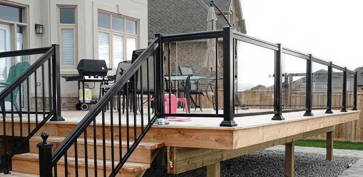 Handrail installation on a deck staircase for safety and code compliance in Saint Louis, MO