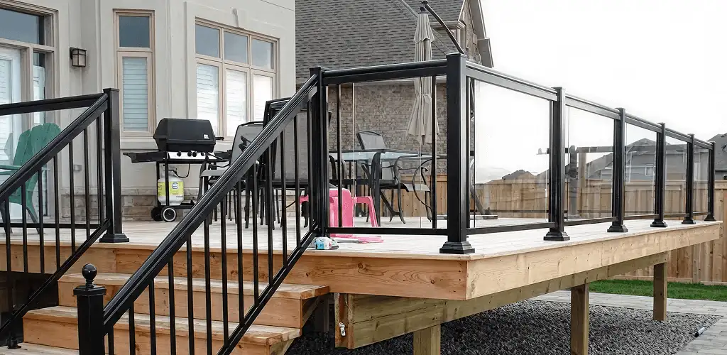 Handrail installation on a deck staircase for safety and code compliance in Saint Louis, MO
